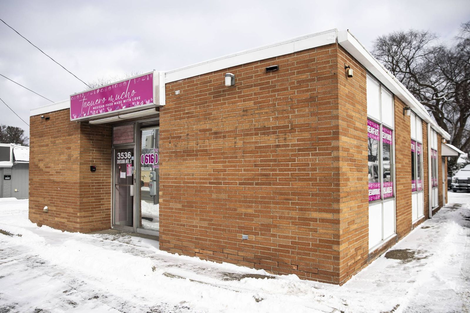 Taquero Mucho storefront with its pink sign at 3536 Division Ave S, Grand Rapids